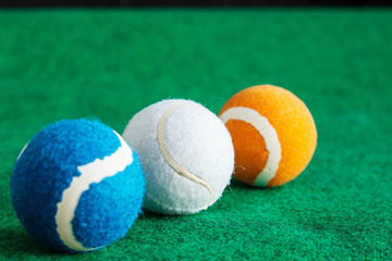 tennis balls on grass.