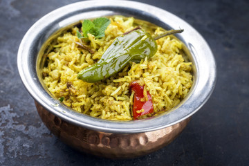 Indian Vegetable Biryani with Sweet Peppers as close-up in a frying pan