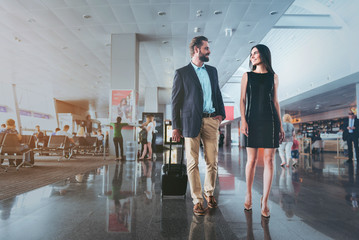 Elegant man and woman are talking to each other