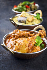 Traditional Indian Curries with Chicken and Vegetable as close-up Korai