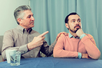 Mature father and son serious talk