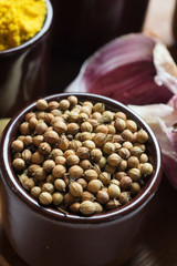 Spices and herbs in ceramic bowls. coriander seasoning. Colorful natural additives.