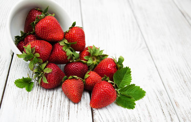 ripe strawberries on wooden table