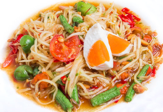 Papaya salad on top with salted egg "Somtum" in Thai, Famous Thai food.