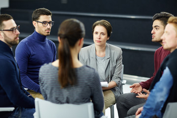 Group of students sharing their problems during psychological session