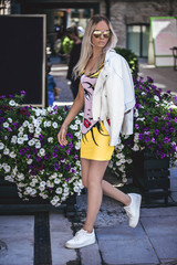 Beautiful blonde model walking outdoors