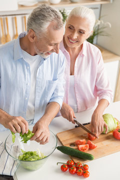 Happy Mature Loving Couple Family Cooking Salad