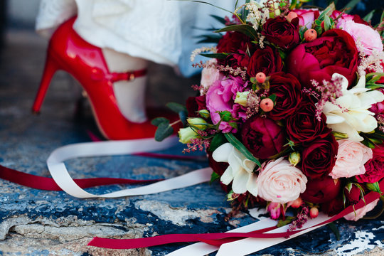 Wedding image and a bridal bouquet with red flowers
