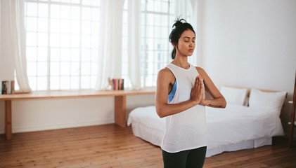 Healthy young woman practising yoga