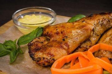 Fried chicken wings with sauce and salad