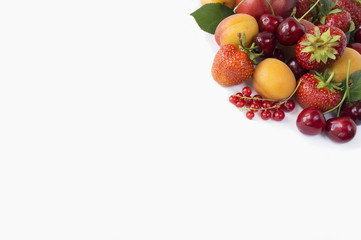 Ripe strawberries, red currants, apricots and cherries on white background. Berries with copy space for text. Background berries. Various fresh summer berries.