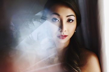Fototapeta na wymiar Blurred picture of stunning Asian woman with red lips