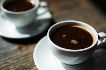 Two cups of hot black coffee