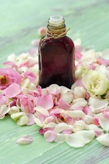 Obraz na płótnie Canvas Rose essential oil and flowers petals for Spa treatments 