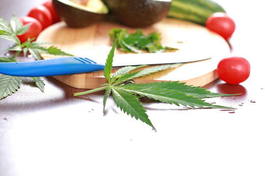 Fresh hemp leaves for salad preparation. The medical cannabis