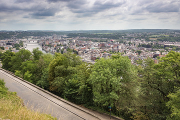 Fototapeta na wymiar The Meuse and Namur under heavy clouds, seen from the citadel