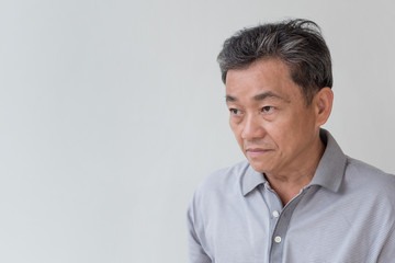 Obraz premium angry, upset, unhappy, frustrated, unfriendly middle age old asian man looking at you