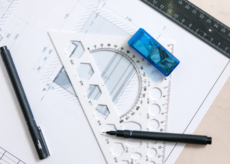 Drawing scheme and tools on desktop of architects workplace
