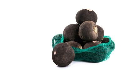 Pile of black turnip isolated on white background