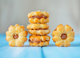 Biscuit with pineapple jam on the blue sky wooden table.