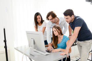 group of four photographer student learning creative portrait during photo shooting in photography school studio