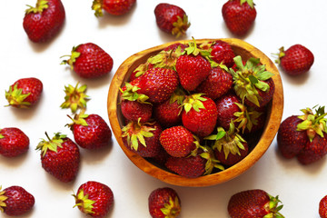 Ripe strawberry on a light table ( Fragaria ananassa). Berry background