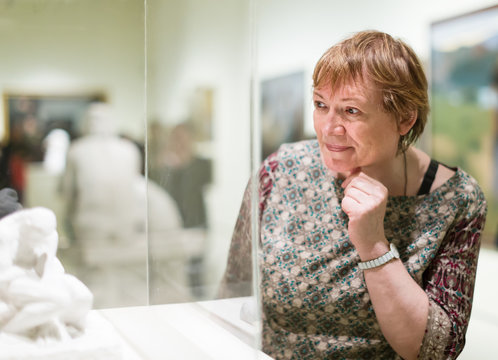 Portrait of senior woman visiting museum