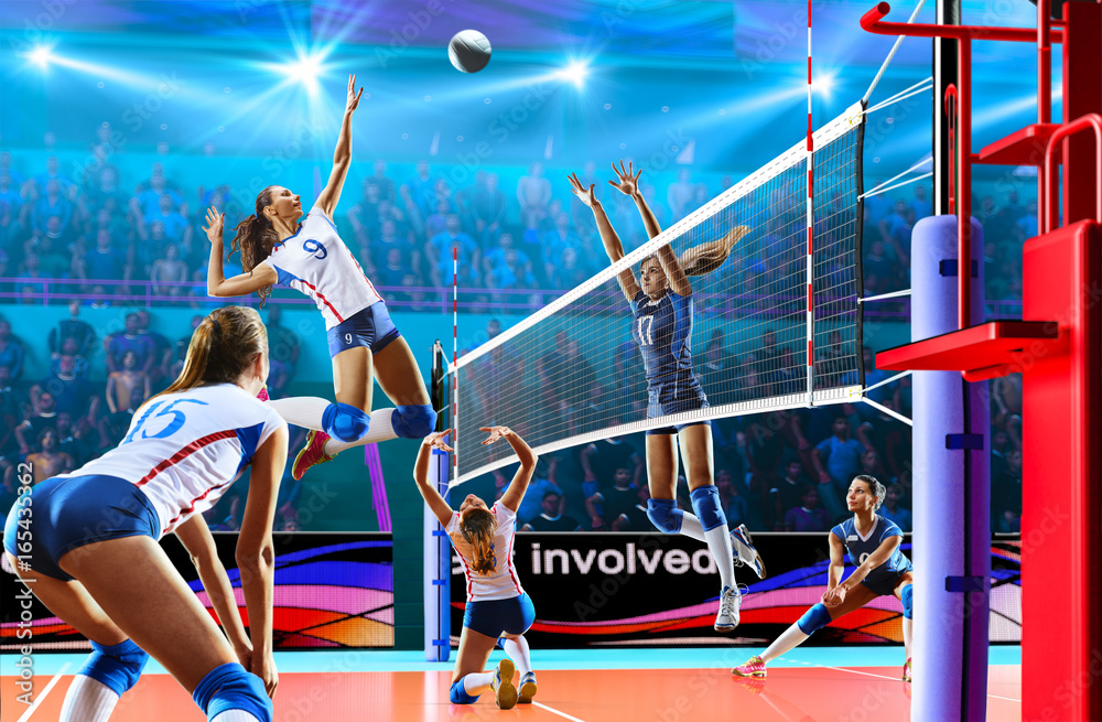 Wall mural Female professional volleyball players in action on grand court