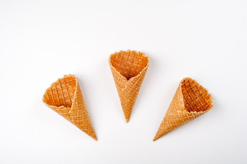 Ice cream cones on white. Pastry cones for summer dessert. Top view