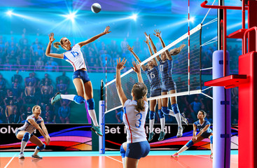 Female professional volleyball players in action on grand court - obrazy, fototapety, plakaty