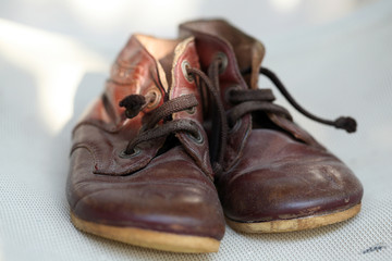 Old leather shoes; close up, selective focus.