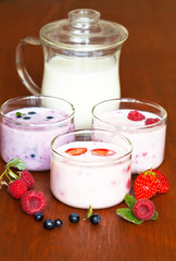 Rustic still life with  homemade berry yogurt on a wooden table. Natural healthy dairy products