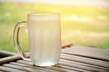 glass of water on a wooden floor