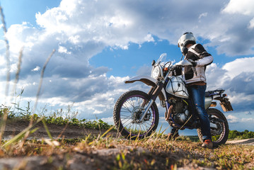 Naklejka na ściany i meble travel motorcycle off road Motorcyclist gear, A motorcycle driver looks, concept, active lifestyle, enduro