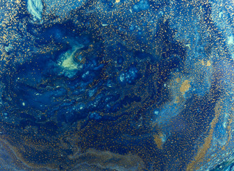 Marbled blue and golden abstract background. Liquid marble pattern