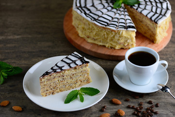Delicious piece of esterhazy cake (torte). Morning cup of coffee with tasty dessert. Food background with a copy space.