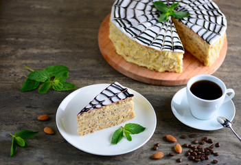 Delicious piece of esterhazy cake (torte). Morning cup of coffee with tasty dessert. Food background with a copy space.