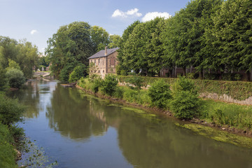 Fototapeta premium Side arm of the Meuse in Sedan at the Sedan mills