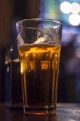 Glass with beer in the bar
