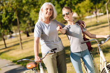 Cheerful teenager girl resting with her grandmother