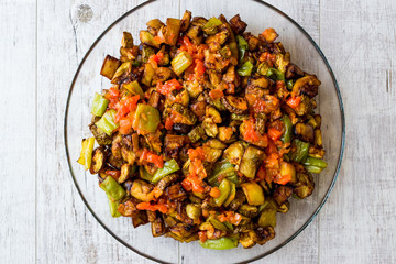 Eggplant Salad with tomatoes in glass bowl.