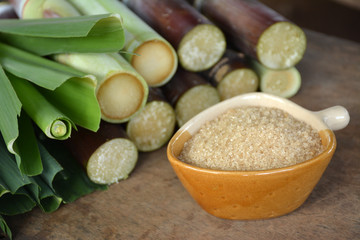 Brown sugar from sugarcane on  wooden table,Agriculture Industry concept.