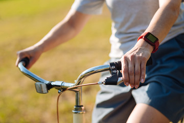 Obraz premium Pleasant adult woman riding her bicycle