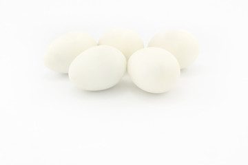 Five white eggs, isolated on white background