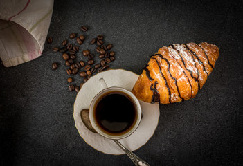 Croissant with chocolate and coffee