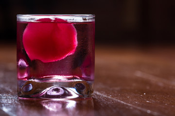 red ice ball in a drink