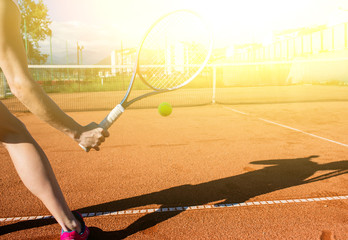 Female hand with tennis racket