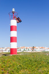 Lighthouse and beach houses in Porto Covo