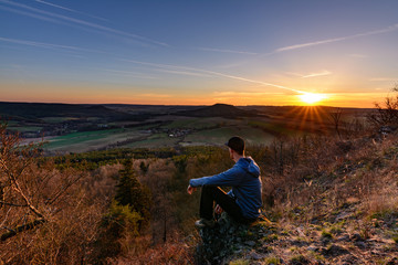 Man and sunset in nature