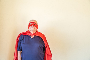 senior superhero looking beyond horizon